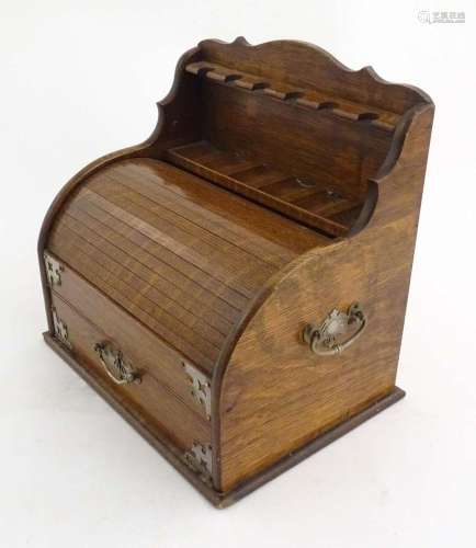An early 20thC oak smokers companion / box with silver plate...