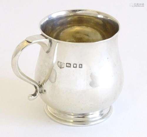 A small silver tankard, hallmarked London 1923, maker Goldsm...