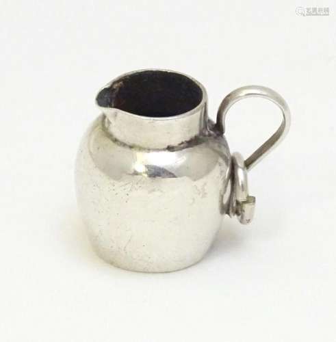 A silver miniature / dolls house model of a cream jug, hallm...