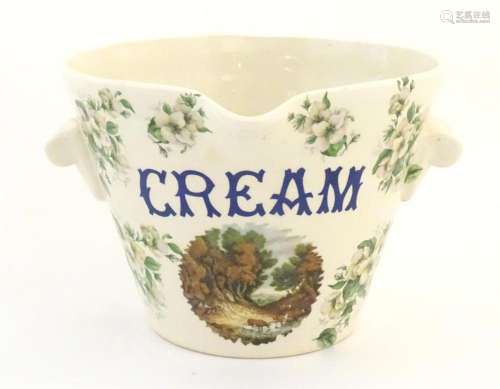 A 20thC twin handled cream / milk pail decorated with a vign...