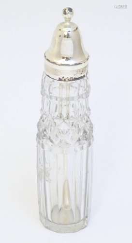 A Geo III cut glass cruet / cayenne bottle with silver mount...