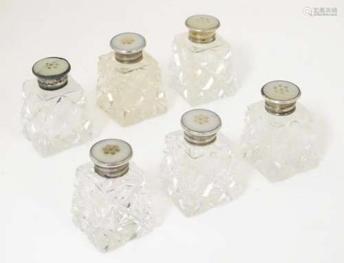 A set of six cut glass peppers with sterling silver tops, ea...