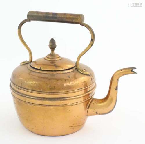 An early 20thC copper kettle, decorated with banding and aco...