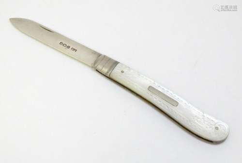 A silver folding fruit knife with mother of pearl handle, ha...