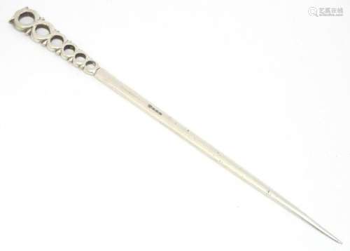 A silver plate meat skewer / letter opener. Approx. 10"...