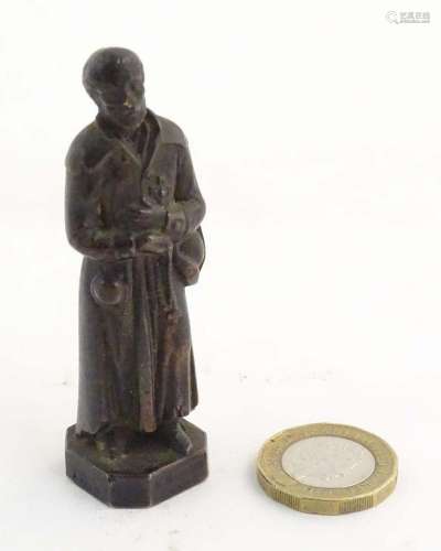 A French bronze model of Saint Benedict Joseph Labre holding...