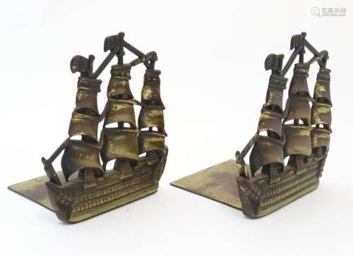 A pair of 19thC cast brass book ends modelled as the ship HM...