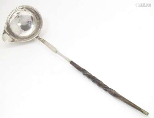 A later 18th / early 19thC white metal toddy / punch ladle w...