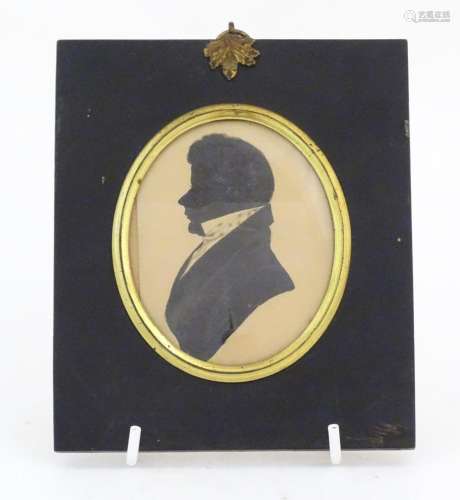 A 19thC watercolour miniature silhouette portrait of a gentl...