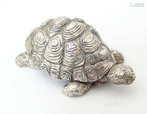A silver model of a tortoise 2 1/2" long