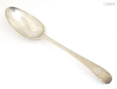 A 19thC silver feather edge tablespoon, hallmarked London 17...