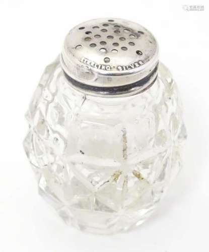 A glass pepper pot with lid marked Sterling Silver 2" h...