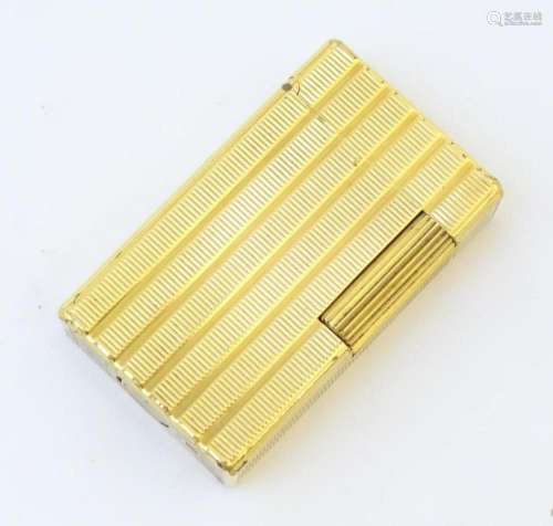 A mid 20thC S.T. Dupont Ligne 1 lighter, with linear gilt fi...