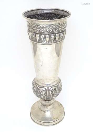 A large Russian silver pedestal vase with floral and scroll ...