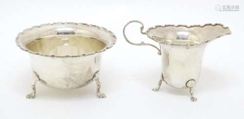 A silver cream jug and sugar bowl hallmarked Birmingham 1950...
