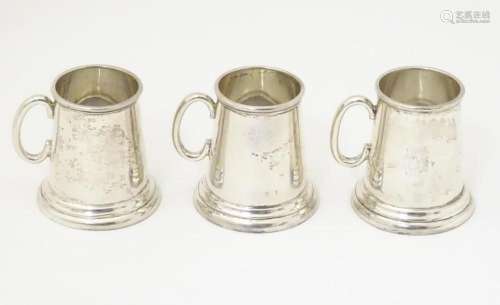 A set of three sterling silver miniature tankards / dram mea...