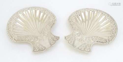 A pair of Victorian silver butter dishes of shell form with ...