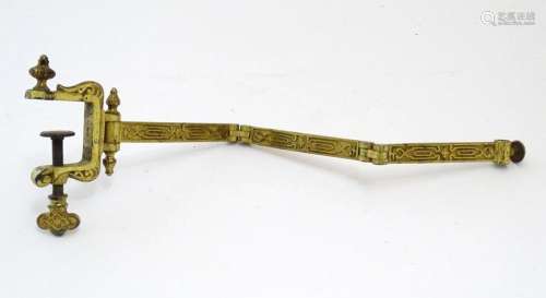 A late 19th / early 20thC cast and gilt fire screen bracket ...