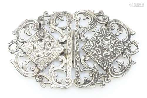 A silver plate two sectional belt buckle. Approx. 3 1/4"...