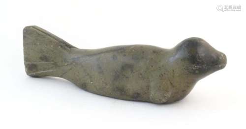 A 20thC Canadian Inuit carved soapstone model of a seal. App...
