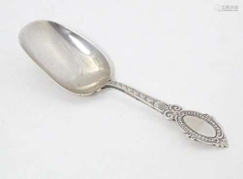 A Victorian silver caddy spoon with oval shield terminal, ha...