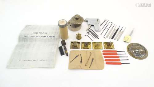 A quantity of locksmith s tools and locks, comprising lock p...