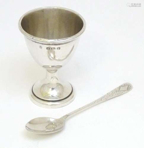 A silver egg cup hallmarked Birmingham 1945, maker A & J...