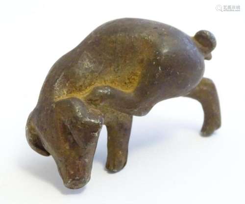 A 20thC cast model of a pig scratching its ear. Approx. 2&qu...