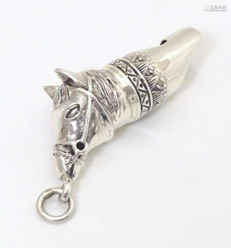 A white metal novelty whistle modelled as a horse. Approx. 1...