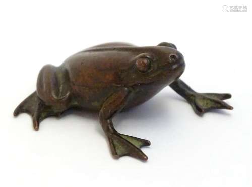 A 20thC cast model of a seated frog. Approx. 1 3/4" lon...