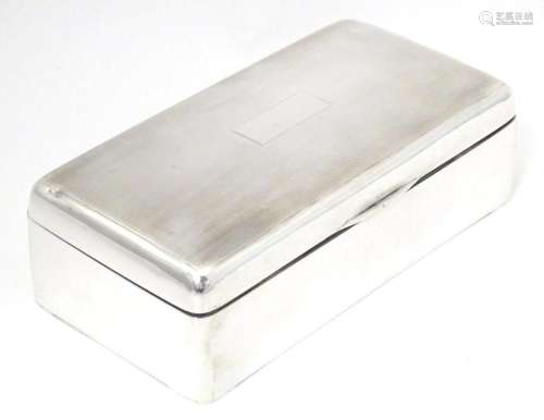 A silver cigarette box of rectangular form, hallmarked Birmi...