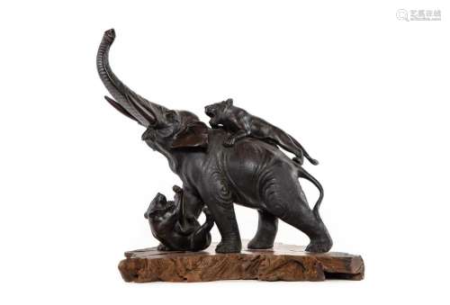 A finely cast Japanese bronze of an elephant with two tigers...