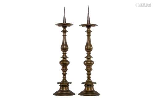 A pair of heavy cast turned brass and iron candlesticks, Dut...