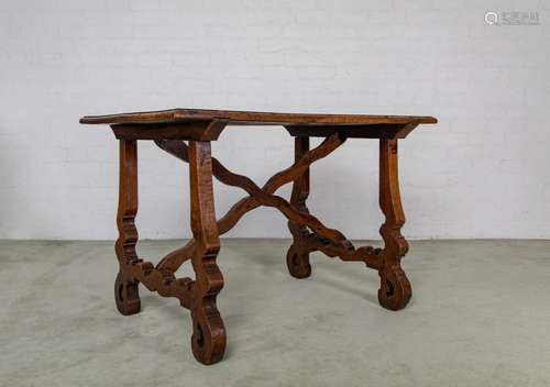 An unusual walnut stretcher table with curvilinear stretcher...