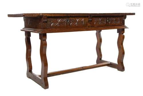 A rare carved walnut two drawer writing table,Basque region,...