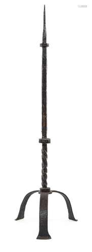 A very rare and early iron floor standing pricket candle-sta...