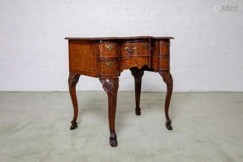 A very pretty burr-walnut veneered serpentine fronted lowboy...