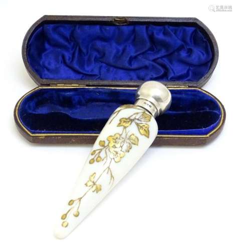 A Victorian scent / perfume bottle / flask with silver top a...