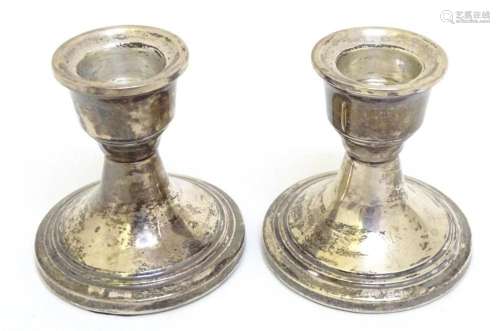 A pair of silver short candlesticks hallmarked Birmingham 19...
