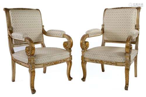 A fabulous pair of very well-carved gilt and white throne ch...