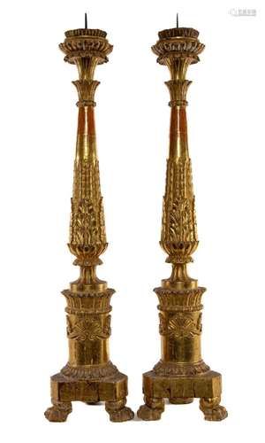 A very fine pair of carved limewood and gilt-gesso torcheres...