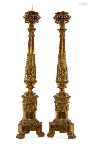 A very fine pair of carved limewood and gilt-gesso torcheres...