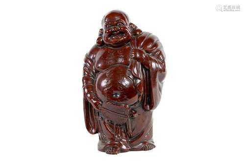 A Japanese stoneware figure of the god Hotai San, circa 1920