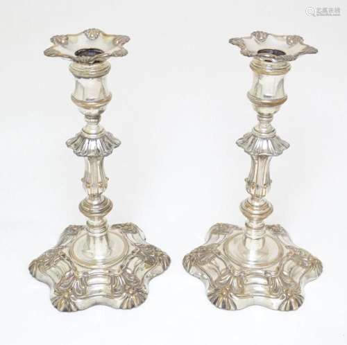 A pair of Sheffield plate candlesticks approx. 9" high