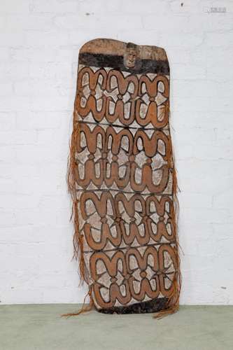 A large wide Asmat war shield,Papua New Guinea,20th century