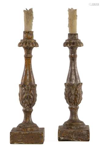 A pair of carved wood and painted candlesticks, Italian circ...