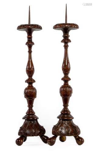 A rare pair of solid carved fruitwood torcheres,Italian circ...