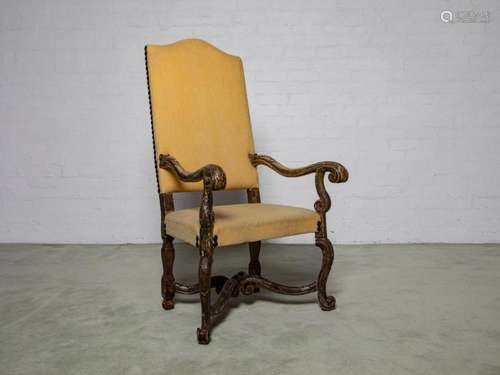 A matching painted and carved armchair in yellow fabric, Ita...