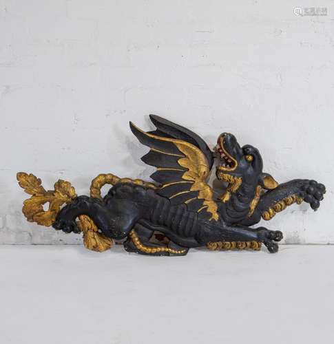 A spectacular pair of gilt and black decorated dragons, Germ...