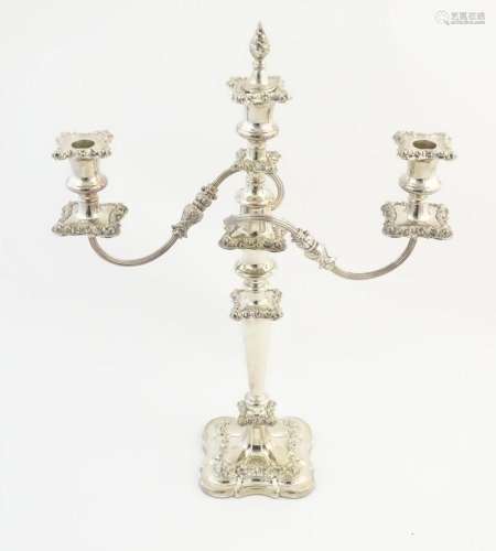 A silver plate table candelabra with two scrolling branches ...